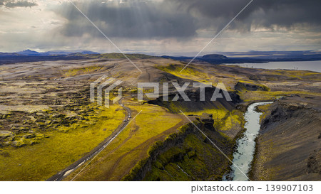 Aerial View of Iceland's Volcanic Canyon with River and Road Aerial View of Iceland's Volcanic Canyon with River and Road 139907103