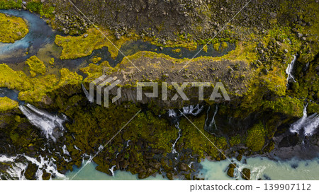 Aerial View of Cascading Waterfalls and Turquoise River in Iceland Aerial View of Cascading Waterfalls and Turquoise River in Iceland 139907112