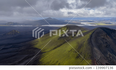 Aerial View of Moss Covered Volcanic Hills and Braided River in Iceland Aerial View of Moss Covered Volcanic Hills and Braided River in Iceland 139907136