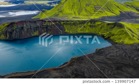 Aerial View of Volcanic Crater Lake with Moss Covered Slopes in Iceland Aerial View of Volcanic Crater Lake with Moss Covered Slopes in Iceland 139907147