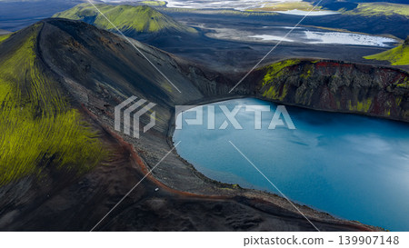 Aerial View of Volcanic Crater Lake and Moss Covered Slopes in Iceland 139907148