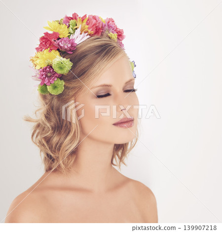 Woman, makeup and flowers on crown in studio with face and confidence for cosmetics, beauty and skincare. Spring aesthetic, model and floral headband with mockup space or wellness on white background 139907218