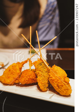 Freshly fried kushikatsu, a traditional Japanese comfort food. Freshly fried kushikatsu, a traditional Japanese comfort food. 139907247