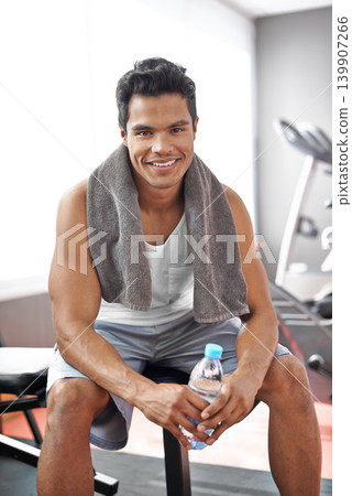 Happy, man and portrait at gym with water bottle for recovery after exercise and body building. Healthy, fitness or person relax after workout with liquid hydration for benefits to wellness in Mexico Happy, man and portrait at gym with water bottle for recovery after exercise and body building. Healthy, fitness or person relax after workout with liquid hydration for benefits to wellness in Mexico 139907266