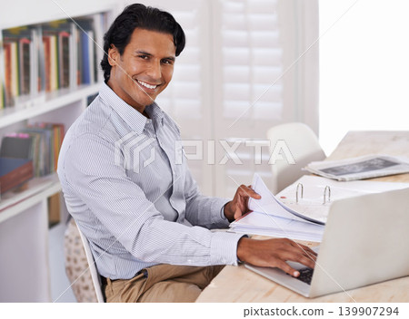 Businessman, laptop and portrait with paperwork in home for remote work, research or online planning in workspace. Financial analyst, person and technology with sales project, happiness and documents Businessman, laptop and portrait with paperwork in home for remote work, research or online planning in workspace. Financial analyst, person and technology with sales project, happiness and documents 139907294