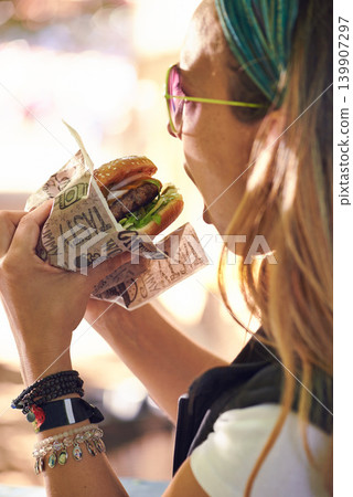 Face, fast food and woman eating burger closeup outdoor for hunger, takeaway or craving in summer. Hamburger, lunch or snack with head of hungry young person biting a beef bun for cuisine or meal Face, fast food and woman eating burger closeup outdoor for hunger, takeaway or craving in summer. Hamburger, lunch or snack with head of hungry young person biting a beef bun for cuisine or meal 139907297