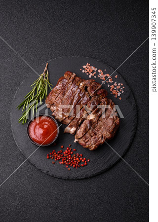 Steak, beef or pork meat grilled or barbecued with salt and spices. Beef steak Steak, beef or pork meat grilled or barbecued with salt and spices. Beef steak 139907345
