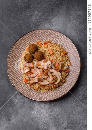 Kabsa or mandi, an Arabic dish with rice and chicken, salt, and spices. Kabsa or mandi Kabsa or mandi, an Arabic dish with rice and chicken, salt, and spices. Kabsa or mandi 139907346