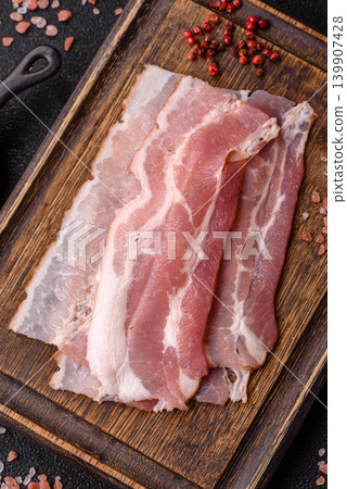 Raw fresh bacon slices with layers of meat or prosciutto with salt and spices. Raw bacon 139907428