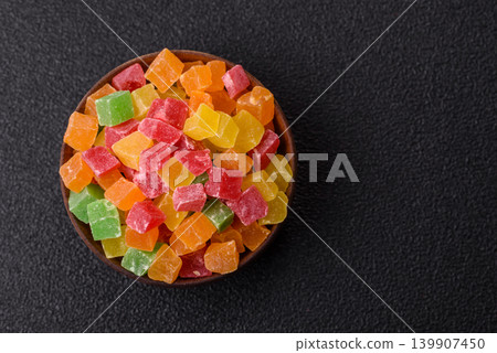 Candied fruit in colorful cubes as an ingredient for baked goods and sweets. Candied fruit Candied fruit in colorful cubes as an ingredient for baked goods and sweets. Candied fruit 139907450