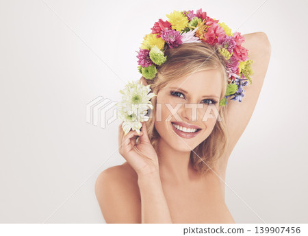 Woman, portrait and flowers on crown in studio with makeup and happy for cosmetics, beauty or skincare. Spring aesthetic, model and face or floral headband with mockup or wellness on white background 139907456