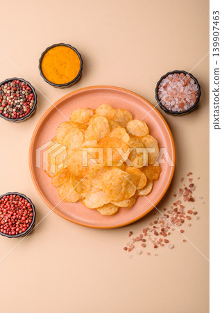 Crispy potato chips, golden slices seasoned with salt and spices. Potato chips 139907463
