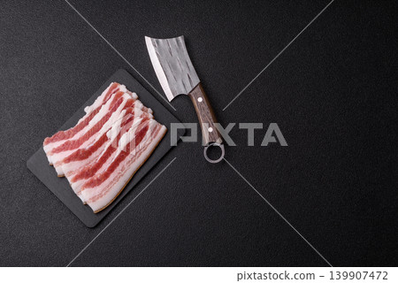Raw fresh bacon slices with layers of meat or prosciutto prepared for frying. Raw bacon Raw fresh bacon slices with layers of meat or prosciutto prepared for frying. Raw bacon 139907472