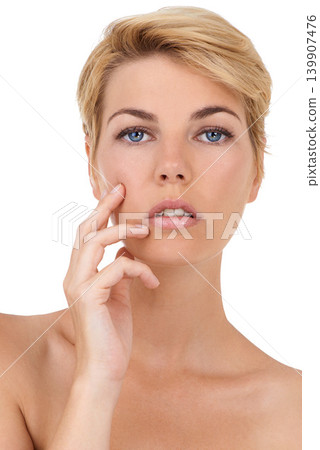 Glow, skincare and woman with hand on face in studio for soft, beauty or clean aesthetic on white background. Dermatology, shine and portrait of female model with anti aging cosmetic satisfaction Glow, skincare and woman with hand on face in studio for soft, beauty or clean aesthetic on white background. Dermatology, shine and portrait of female model with anti aging cosmetic satisfaction 139907476