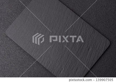 A blank slate board on a dark background for Asian food. A blank slate board A blank slate board on a dark background for Asian food. A blank slate board 139907505