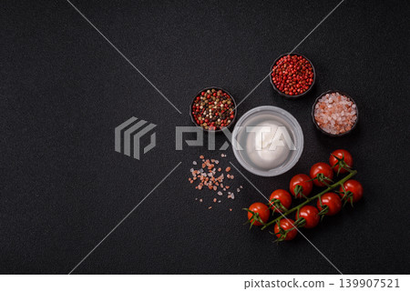 Fresh white burrata cheese with tomatoes for a salad. Burrata cheese Fresh white burrata cheese with tomatoes for a salad. Burrata cheese 139907521
