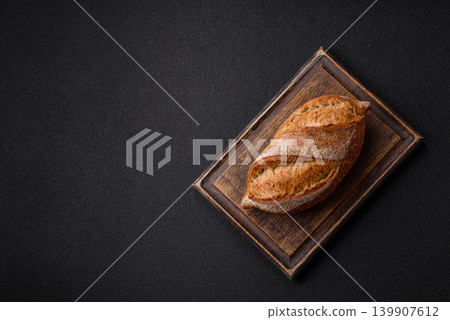 A loaf of homemade whole grain rye bread for the dinner table. A loaf of rye bread 139907612