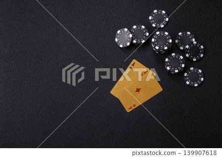 Playing cards and chips on a table, a gambling game of blackjack or baccarat. Cards and chips Playing cards and chips on a table, a gambling game of blackjack or baccarat. Cards and chips 139907618