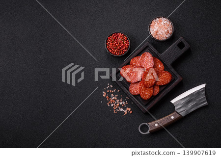 Sliced smoked pepperoni or salami as a pizza topping. Pepperoni sausage Sliced smoked pepperoni or salami as a pizza topping. Pepperoni sausage 139907619