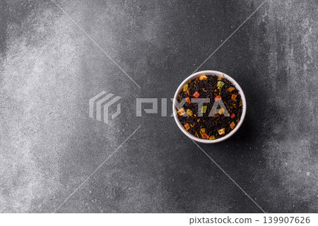 Dry black tea with herbal leaves and aromatic additives. Dry fruity black tea Dry black tea with herbal leaves and aromatic additives. Dry fruity black tea 139907626