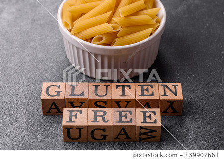 Italian uncooked, dry, gluten free penne pasta, ready for cooking. Dry, gluten free penne pasta Italian uncooked, dry, gluten free penne pasta, ready for cooking. Dry, gluten free penne pasta 139907661