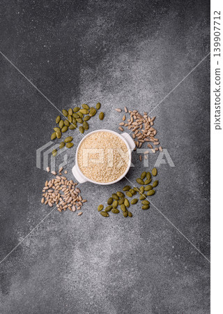 White sesame seeds in a bowl, an ingredient for oil and healthy eating. White sesame 139907712