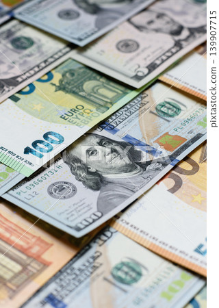 Euro and dollar banknotes, exchange, sales, economic tariffs and taxes. Euros and dollars Euro and dollar banknotes, exchange, sales, economic tariffs and taxes. Euros and dollars 139907715