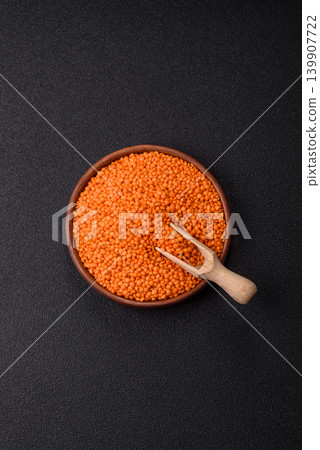 Raw red lentils as a source of protein for a healthy vegan meal. Red lentils Raw red lentils as a source of protein for a healthy vegan meal. Red lentils 139907722