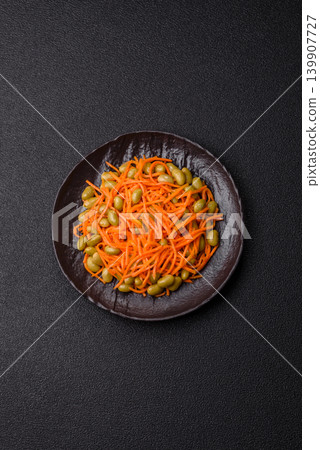 Asian salad with edamame beans, carrots, tofu, and spices. Edamame and carrot salad 139907727