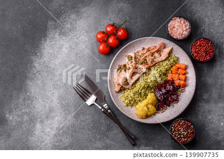 A bowl with chicken or turkey, porridge, vegetables, sauce, and spices. A meat bowl A bowl with chicken or turkey, porridge, vegetables, sauce, and spices. A meat bowl 139907735