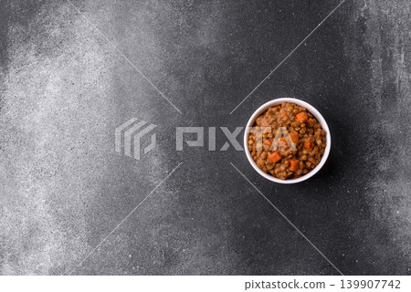 Lentil, carrot, and tomato stew with sausages, a European dish. Lentils with sausages Lentil, carrot, and tomato stew with sausages, a European dish. Lentils with sausages 139907742