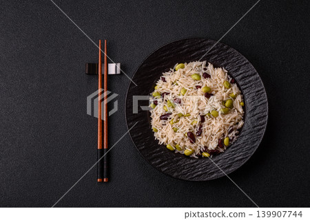 Asian food with rice, edamame, carrots, tofu, and spices. Rice with edamame Asian food with rice, edamame, carrots, tofu, and spices. Rice with edamame 139907744