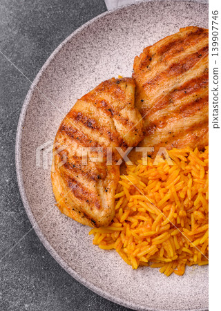 Dajaj Mashwi, an Arabic dish with rice and chicken, salt, and spices. Dajaj Mashwi as a background Dajaj Mashwi, an Arabic dish with rice and chicken, salt, and spices. Dajaj Mashwi as a background 139907746