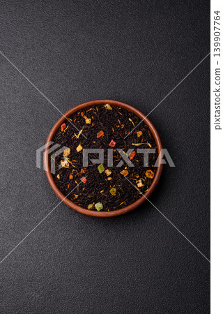 Dry black tea with herbal leaves and aromatic additives. Dry fruity black tea Dry black tea with herbal leaves and aromatic additives. Dry fruity black tea 139907764