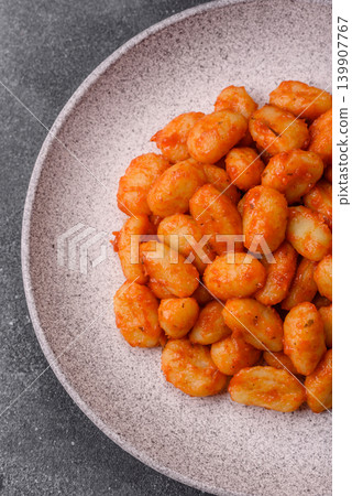 Homemade potato gnocchi with Bolognese sauce, seasoned with salt and spices. Gnocchi with sauce Homemade potato gnocchi with Bolognese sauce, seasoned with salt and spices. Gnocchi with sauce 139907767