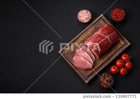 Smoked or dry cured meat slices, pork or ham with salt and spices. Smoked meat slices 139907771