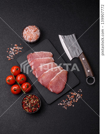Smoked or dry cured meat slices, pork or ham with salt and spices. Smoked meat slices Smoked or dry cured meat slices, pork or ham with salt and spices. Smoked meat slices 139907772
