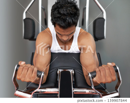 Challenge, weights and man with gym machine, fitness and workout with endurance and progress. Bodybuilder, person and guy in a wellness center, strong and muscle with strength training and healthy Challenge, weights and man with gym machine, fitness and workout with endurance and progress. Bodybuilder, person and guy in a wellness center, strong and muscle with strength training and healthy 139907844