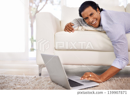 Laptop, remote work or portrait of businessman on sofa streaming, video or social media at home. Pc, search or freelancer in living room with online tutorial for elearning, upskill or training course Laptop, remote work or portrait of businessman on sofa streaming, video or social media at home. Pc, search or freelancer in living room with online tutorial for elearning, upskill or training course 139907871