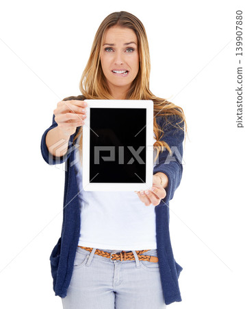 Portrait, woman and showing tablet screen for mockup, advertising or promotion. Confused, person and technology for internet or space on display for social media isolated on white studio background Portrait, woman and showing tablet screen for mockup, advertising or promotion. Confused, person and technology for internet or space on display for social media isolated on white studio background 139907880