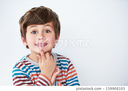 Portrait, kid and boy thinking in studio isolated on a white background mockup space. Face, idea and young child with cute facial expression, innocent and casual clothes on a backdrop in Australia 139908103