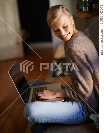 Remote work, laptop and happy woman in a house for research, planning or web communication. Freelance, smile and female person in living room with social media, blog or copywriting, project or task Remote work, laptop and happy woman in a house for research, planning or web communication. Freelance, smile and female person in living room with social media, blog or copywriting, project or task 139908141