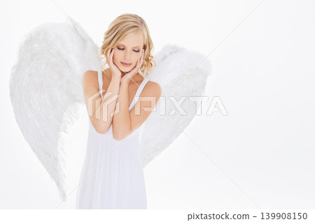 Woman, face and beauty in studio with angel wings for halloween dress up, celestial fashion and confidence. Model, person and thinking with heavenly costume and purity aesthetic on white background Woman, face and beauty in studio with angel wings for halloween dress up, celestial fashion and confidence. Model, person and thinking with heavenly costume and purity aesthetic on white background 139908150