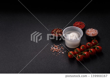 Fresh white burrata cheese with tomatoes for a salad. Burrata cheese Fresh white burrata cheese with tomatoes for a salad. Burrata cheese 139908167