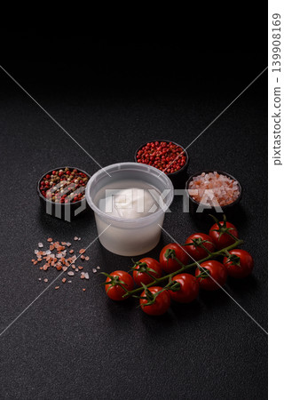 Fresh white burrata cheese with tomatoes for a salad. Burrata cheese Fresh white burrata cheese with tomatoes for a salad. Burrata cheese 139908169