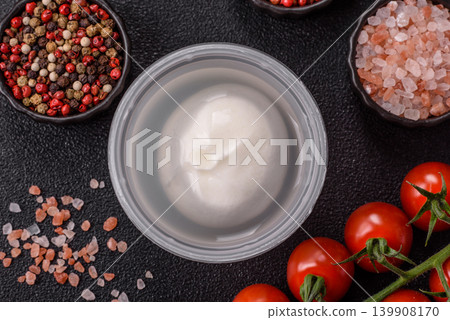 Fresh white burrata cheese with tomatoes for a salad. Burrata cheese Fresh white burrata cheese with tomatoes for a salad. Burrata cheese 139908170