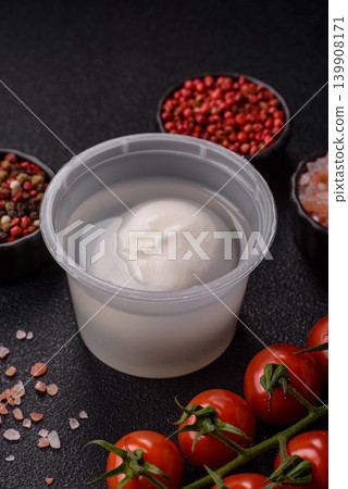 Fresh white burrata cheese with tomatoes for a salad. Burrata cheese Fresh white burrata cheese with tomatoes for a salad. Burrata cheese 139908171