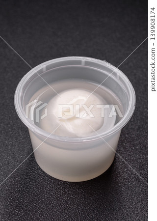 Fresh white burrata cheese with tomatoes for a salad. Burrata cheese Fresh white burrata cheese with tomatoes for a salad. Burrata cheese 139908174