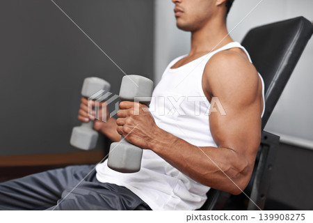 Closeup, dumbbells and man with fitness, exercise and strength training with progress and challenge. Bodybuilder, gym and person with gym equipment and muscle with workout, wellness center and power Closeup, dumbbells and man with fitness, exercise and strength training with progress and challenge. Bodybuilder, gym and person with gym equipment and muscle with workout, wellness center and power 139908275