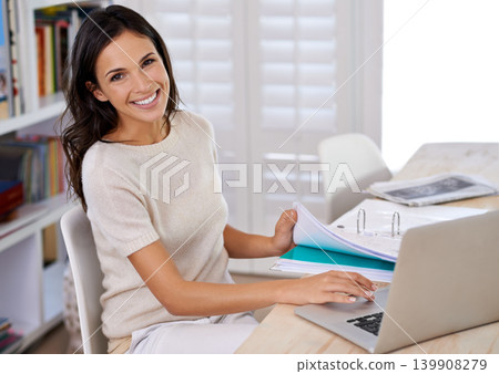 Documents, happy and portrait of woman with laptop working on creative project at home office. Smile, technology and female freelance designer with paperwork and computer in workspace at apartment. Documents, happy and portrait of woman with laptop working on creative project at home office. Smile, technology and female freelance designer with paperwork and computer in workspace at apartment. 139908279